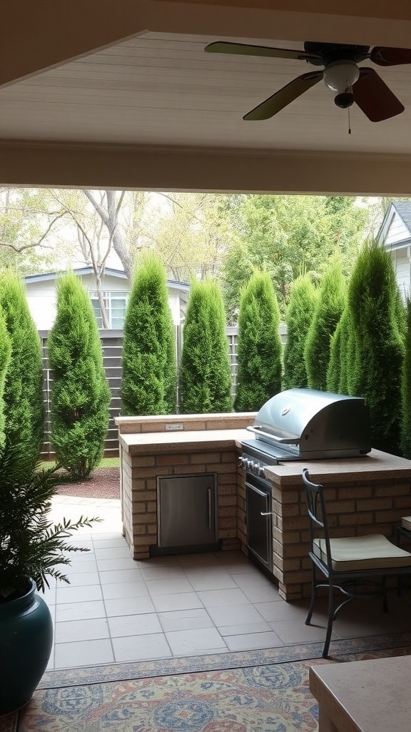 Outdoor kitchen area featuring a grill, counter space, and tall green privacy hedges.